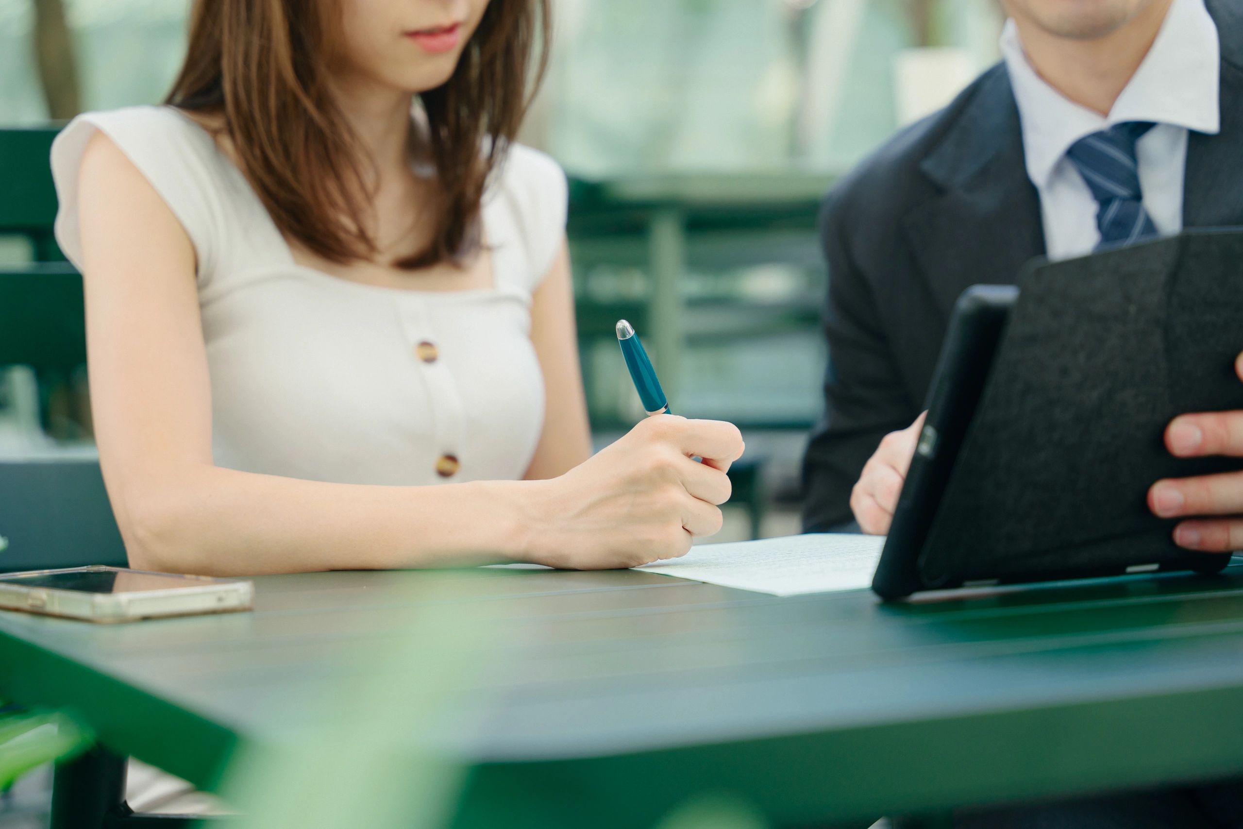 Professional meeting with documents at a table