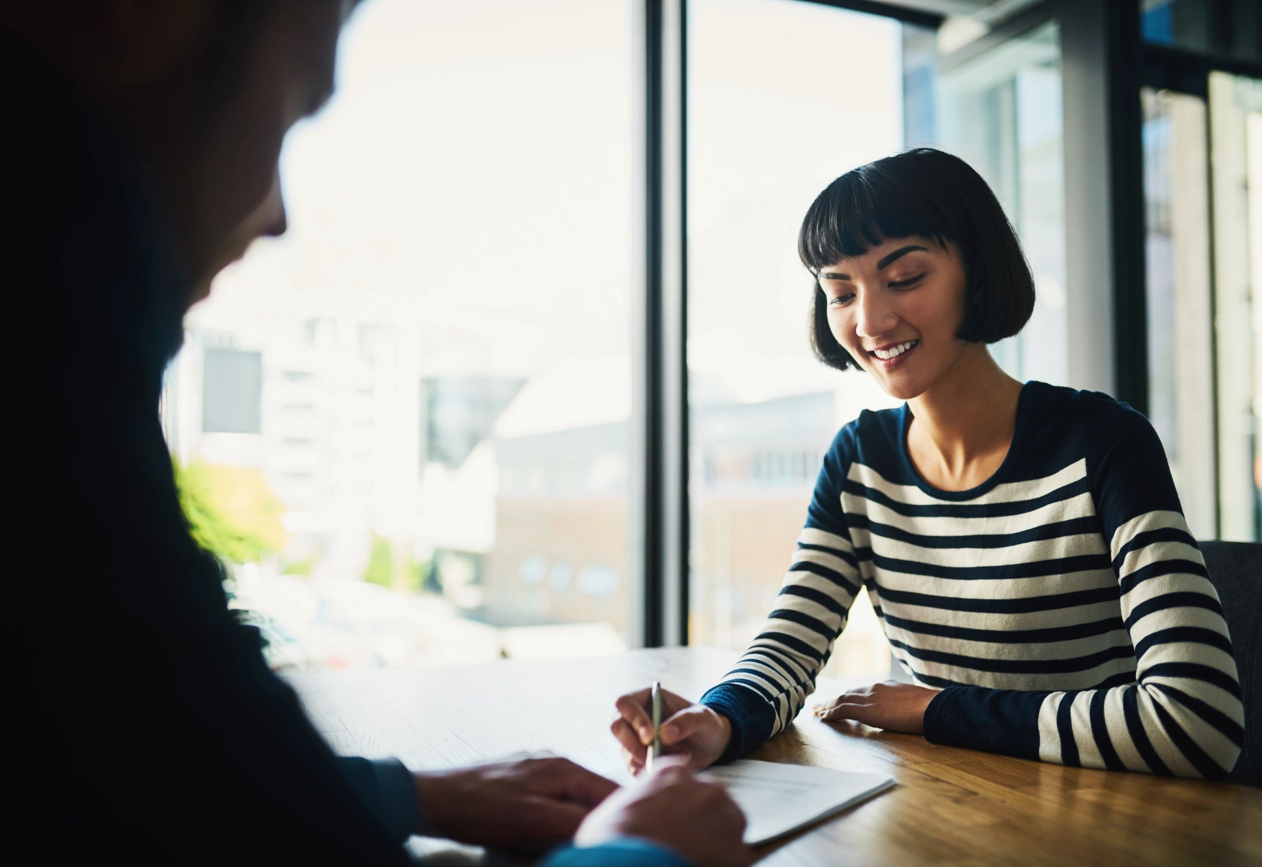Business professionals reviewing paperwork together